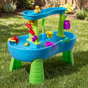 Blue and green toddler water play table with waterfall in a sunny garden
